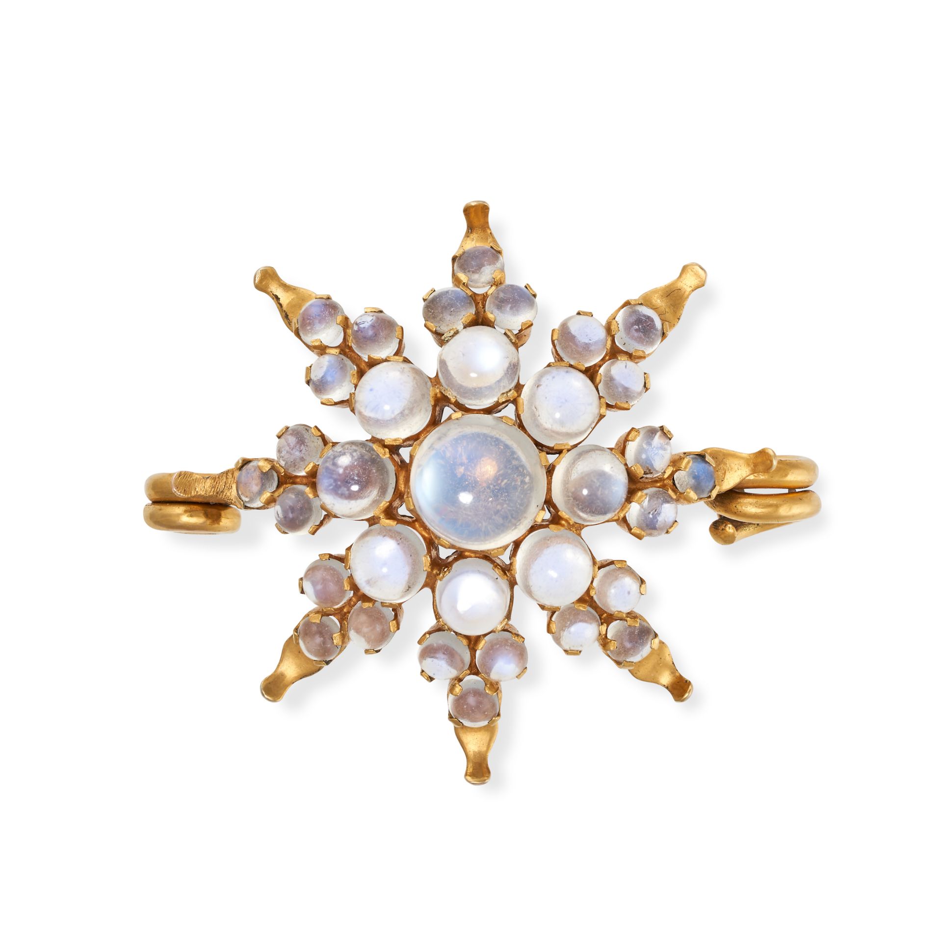 AN ANTIQUE MOONSTONE STAR BROOCH in 9ct yellow gold, the brooch designed as a eight rayed star se...