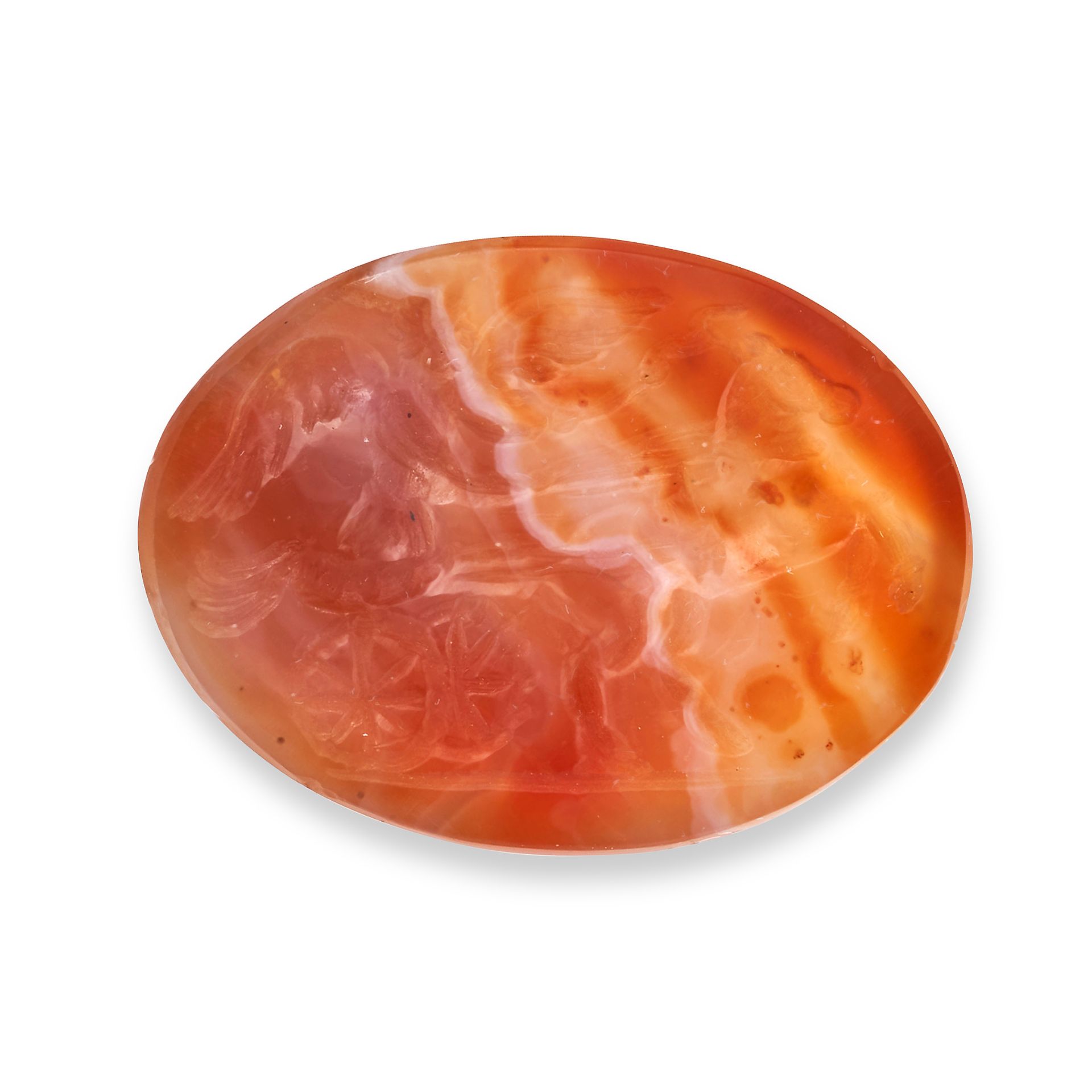 AN UNMOUNTED CARNELIAN INTAGLIO carved to depict a winged figure driving a chariot, 2.5cm, 3.3g.