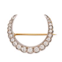 A DIAMOND CRESCENT MOON BROOCH in yellow gold, designed as a crescent moon set with a row of roun...