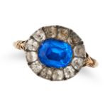 AN ANTIQUE GEORGIAN PASTE CLUSTER RING in yellow gold and silver, set with a cushion cut blue pas...
