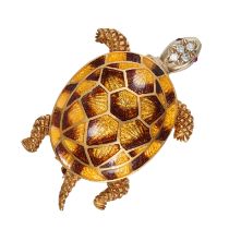 AN ENAMEL, RUBY AND DIAMOND TORTOISE BROOCH in 18ct yellow and white gold, designed as a tortoise...