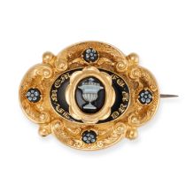 AN ANTIQUE VICTORIAN MOURNING BROOCH in yellow gold, set to the centre with a carved sardonyx cam...