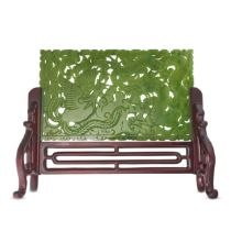 A CHINESE SPINACH-GREEN JADE TABLE SCREEN, 20TH CENTURY comprising a rectangular panel oriented h...