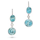 A PAIR OF BLUE ZIRCON AND DIAMOND DROP EARRINGS each set with an oval cut blue zircon suspending ...