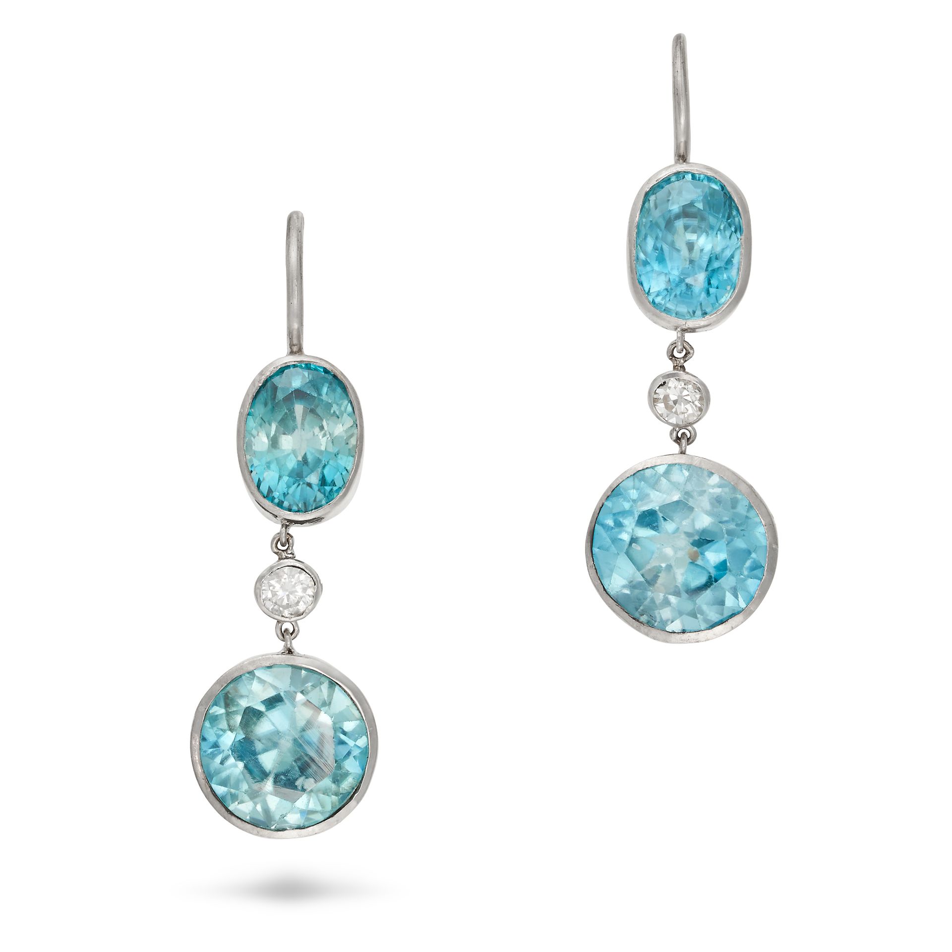 A PAIR OF BLUE ZIRCON AND DIAMOND DROP EARRINGS each set with an oval cut blue zircon suspending ...