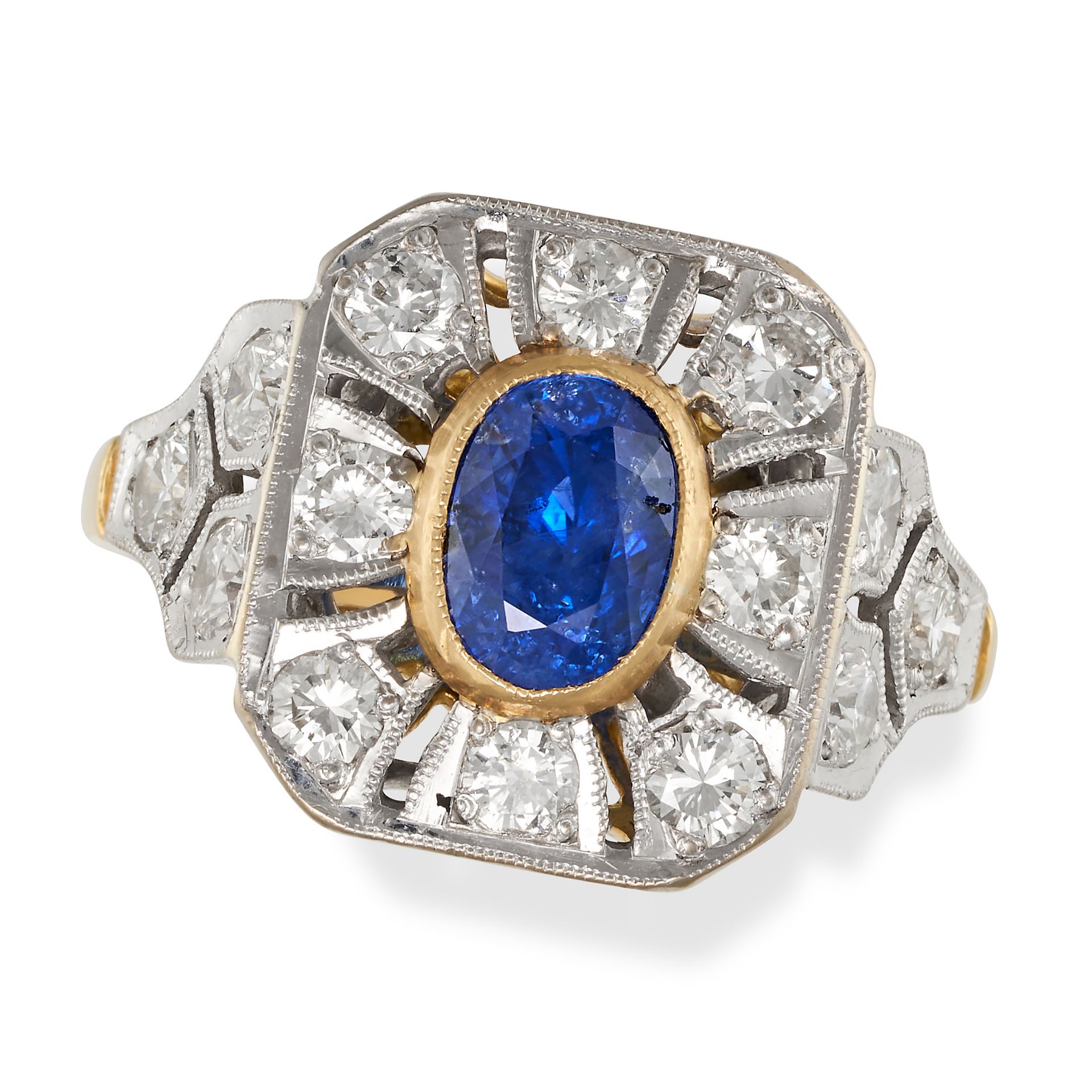 A SAPPHIRE AND DIAMOND CLUSTER RING in 18ct yellow and white gold, set with an oval cut sapphire ...