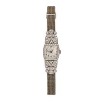 AN VINTAGE DIAMOND COCKTAIL WATCH in platinum and 18ct white gold, cushion shaped silvered dial w...