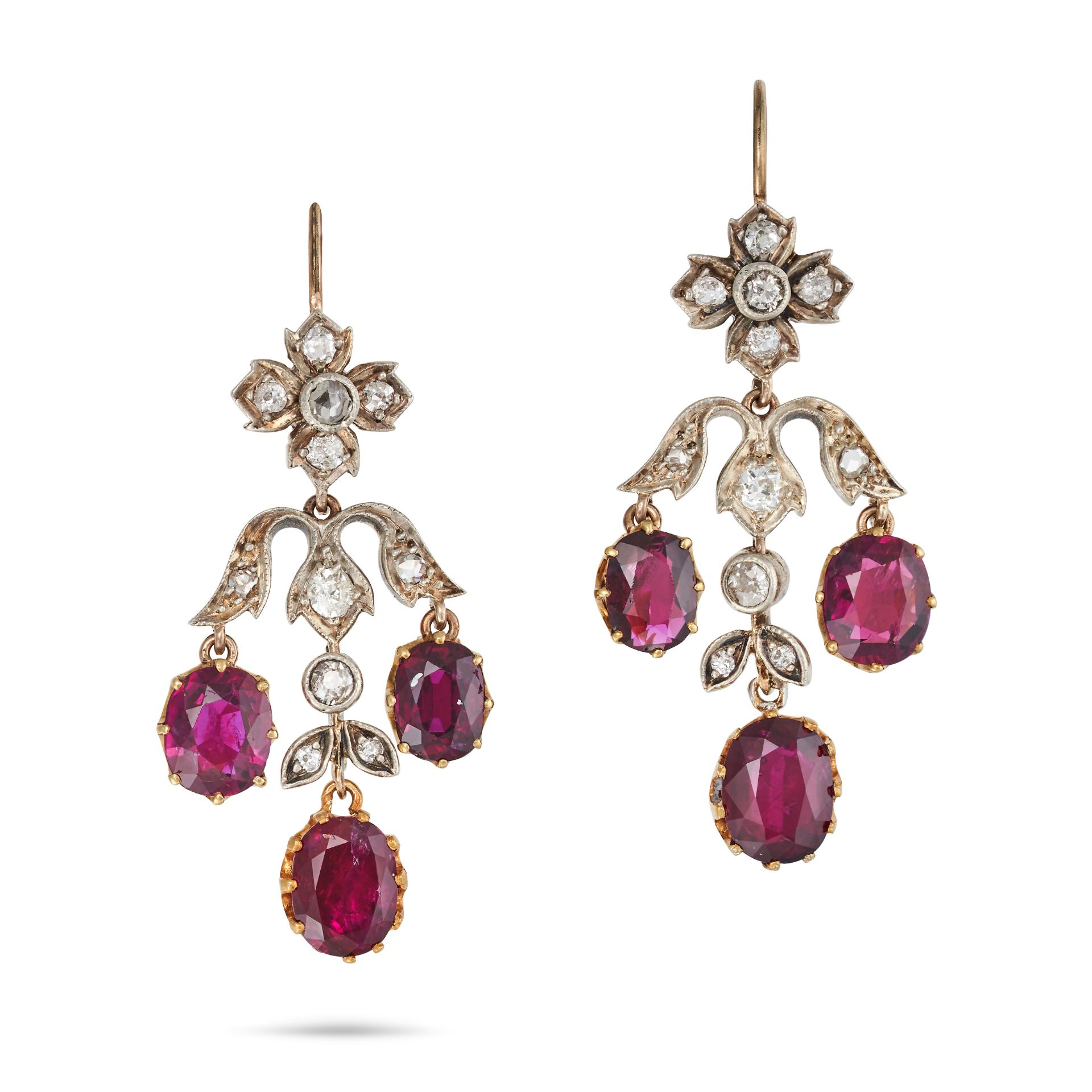 A PAIR OF DIAMOND AND RUBY DROP EARRINGS in yellow gold, each comprising a foliate top set with o...