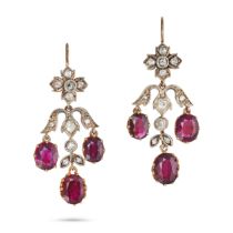 A PAIR OF DIAMOND AND RUBY DROP EARRINGS in yellow gold, each comprising a foliate top set with o...