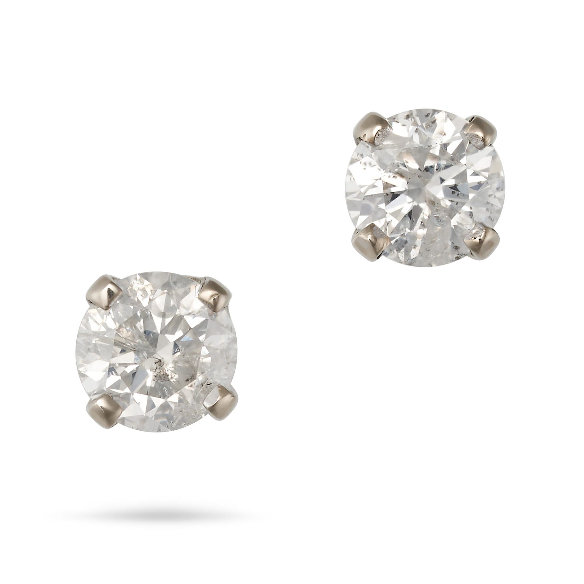 A PAIR OF DIAMOND STUD EARRINGS in white gold, each set with a round brilliant cut diamond, butte...