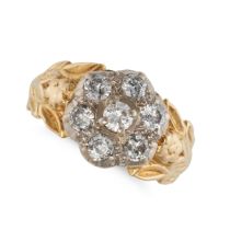 A DIAMOND CLUSTER RING in 18ct yellow gold and platinum, set with a floral cluster of round brill...