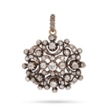 AN ANTIQUE DIAMOND PENDANT / BROOCH in 15ct yellow gold and silver, of stylised design set throug...