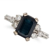 A SAPPHIRE AND DIAMOND RING in white gold, set with an octagonal step cut sapphire of approximate...