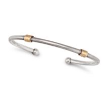 NO RESERVE - TIFFANY & CO., A TWO TONE TORQUE BANGLE in sterling silver and 18ct yellow gold, the...