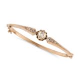 AN ANTIQUE DIAMOND BANGLE in yellow gold, the hinged bangle set with a rose cut diamond accented ...