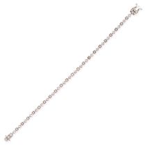 A DIAMOND LINE BRACELET in 18ct white gold, comprising a row of round brilliant cut diamonds, sta...