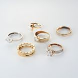 A COLLECTION OF GEMSET JEWELLERY comprising three solitaire rings in 14ct gold, set with round cu...