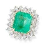 A COLOMBIAN EMERALD AND DIAMOND CLUSTER RING in white gold, set with an octagonal step cut emeral...