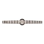 A FRENCH ART DECO DIAMOND AND ONYX BAR BROOCH in platinum, set with a row of old cut diamonds acc...