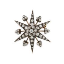 AN ANTIQUE DIAMOND STAR BROOCH in yellow gold and silver, designed as a six rayed star set throug...