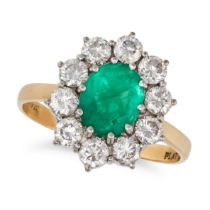 AN EMERALD AND DIAMOND CLUSTER RING in 18ct yellow gold and platinum, set with an oval cut emeral...