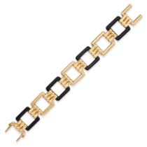 AN ONYX BRACELET in yellow gold, comprising a row of openwork geometric polished onyx and gold li...