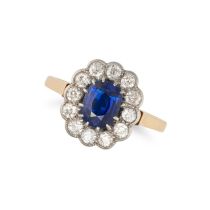 NO RESERVE - A SAPPHIRE AND DIAMOND CLUSTER RING in 18ct yellow gold, set with a cushion cut sapp...