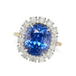 A 10.21 CARAT CEYLON NO HEAT SAPPHIRE AND DIAMOND CLUSTER RING in 18ct yellow gold, set with a cu...
