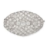 A FINE ART DECO DIAMOND BROOCH in platinum, the openwork oval shaped body set throughout with old...
