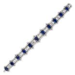 A SAPPHIRE AND DIAMOND BRACELET in platinum, comprising a row of oval cut sapphires and baguette ...