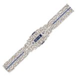 A SAPPHIRE AND DIAMOND BRACELET in platinum, in scrolling openwork design, the centre plaque set ...