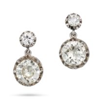 A PAIR OF DIAMOND DROP EARRINGS in white gold and platinum, each set with an old cut diamond susp...