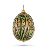 A DIAMOND AND ENAMEL EGG PENDANT in yellow gold, the large egg-shaped pendant relieved in green e...