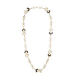 MARINA B., A MOTHER OF PEARL SAUTOIR NECKLACE in 18ct yellow gold, comprising a fancy link chain ...
