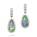 A PAIR OF FINE BLACK OPAL AND DIAMOND EARRINGS in 18ct yellow gold, each set with a pear shaped c...