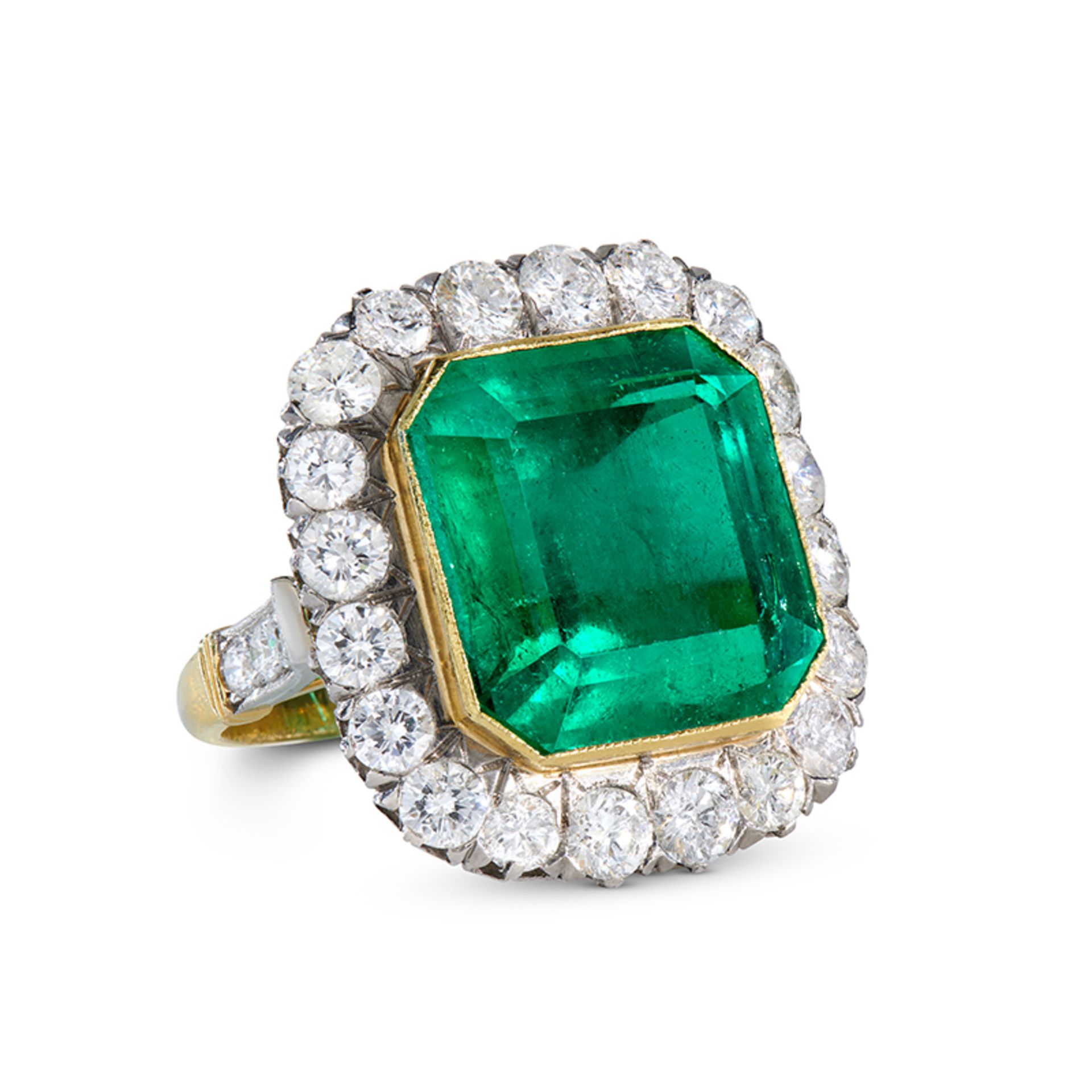 A FINE COLOMBIAN EMERALD AND DIAMOND RING in 18ct yellow gold, set with an octagonal step cut eme...