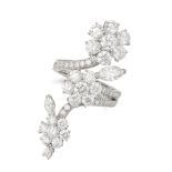 VAN CLEEF & ARPELS, A DIAMOND FOLIE DES PRES RING in 18ct white gold, in floral design, set throu...