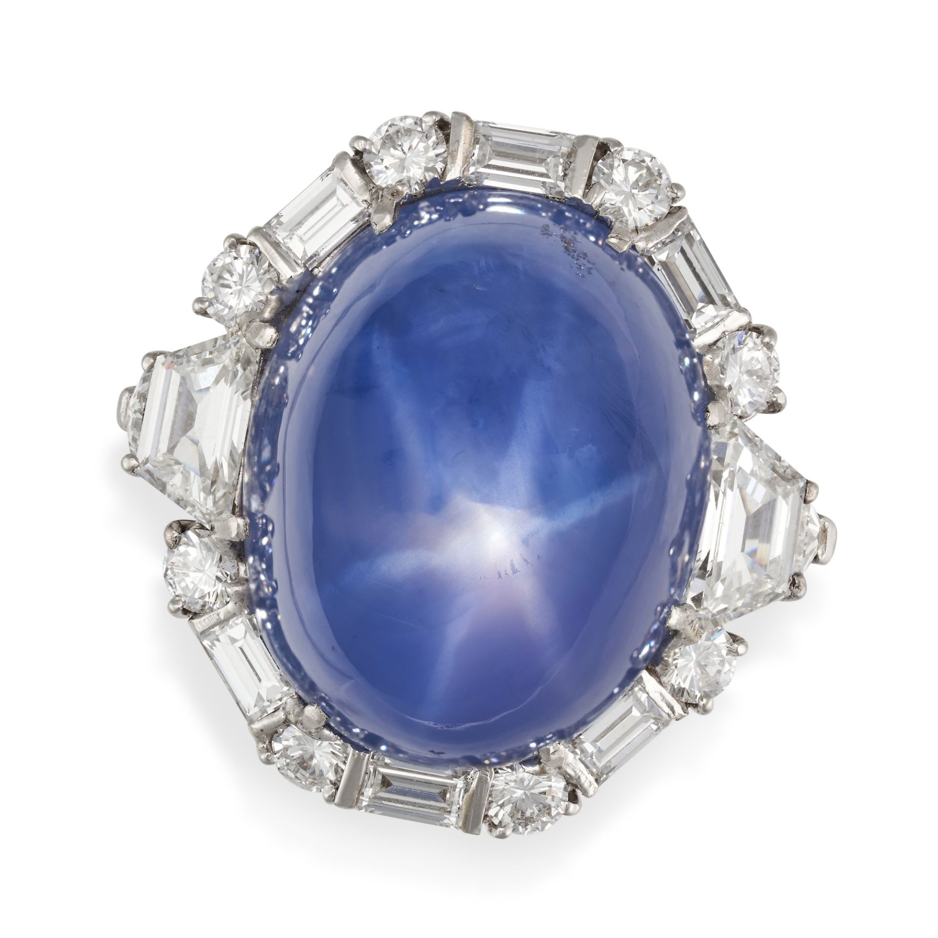 BULGARI, AN IMPORTANT STAR SAPPHIRE AND DIAMOND RING in platinum, set with a cabochon star sapphi...