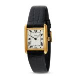 JEAN PERRET - A JEAN PERRET TANK WRISTWATCH in yellow gold, the rectangular white dial with Roman...