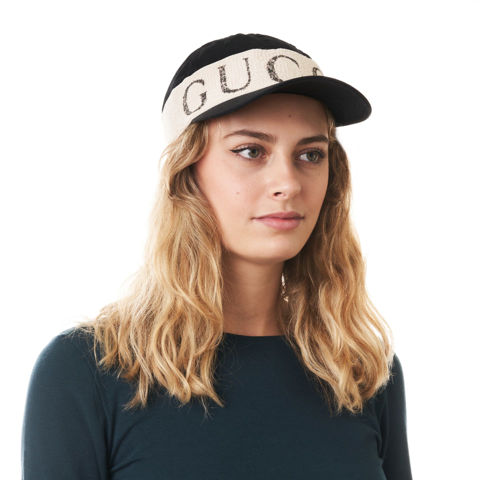 GUCCI LOGO BASEBALL HAT Size L, 59. Black fabric baseball cap with ivory toned 'Gucci' logo deta...