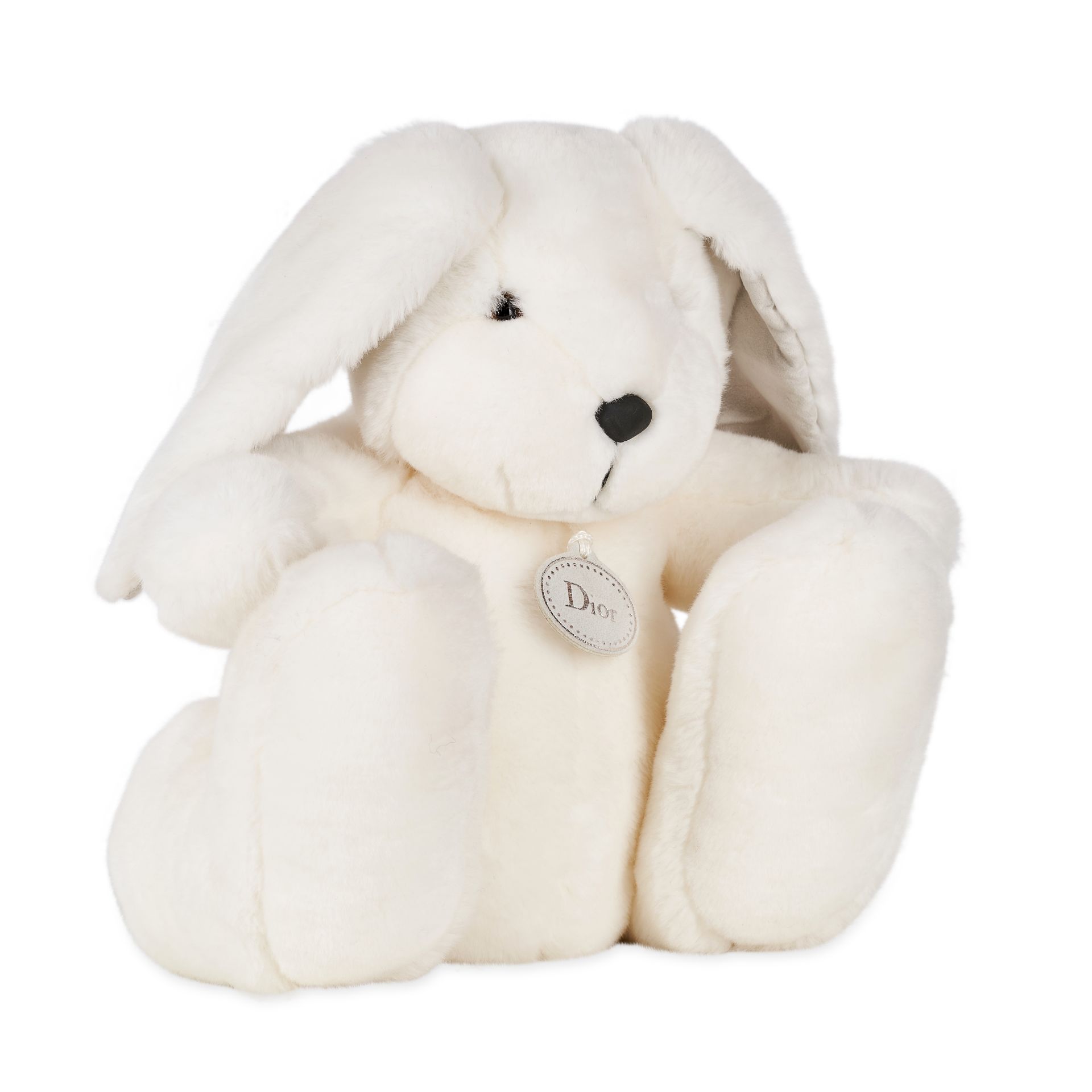 CHRISTIAN DIOR RABBIT STUFFED TOY Condition grade A. 25cm long, 28cm high. Ivory toned faux fur...