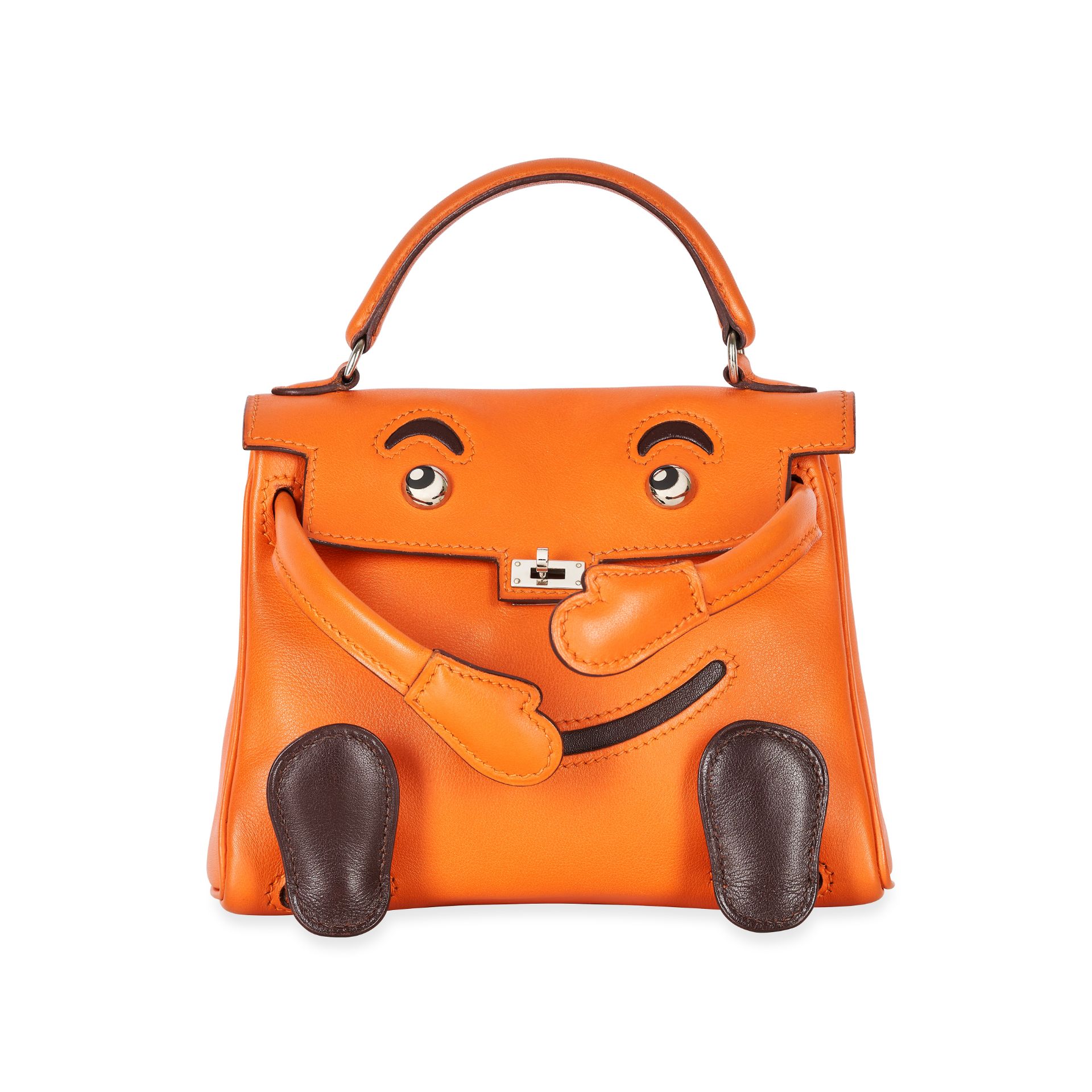 HERMES, A RARE ORANGE H AND ÉBÈNE SWIFT LEATHER QUELLE IDOLE KELLY DOLL BAG Condition grade B. ...
