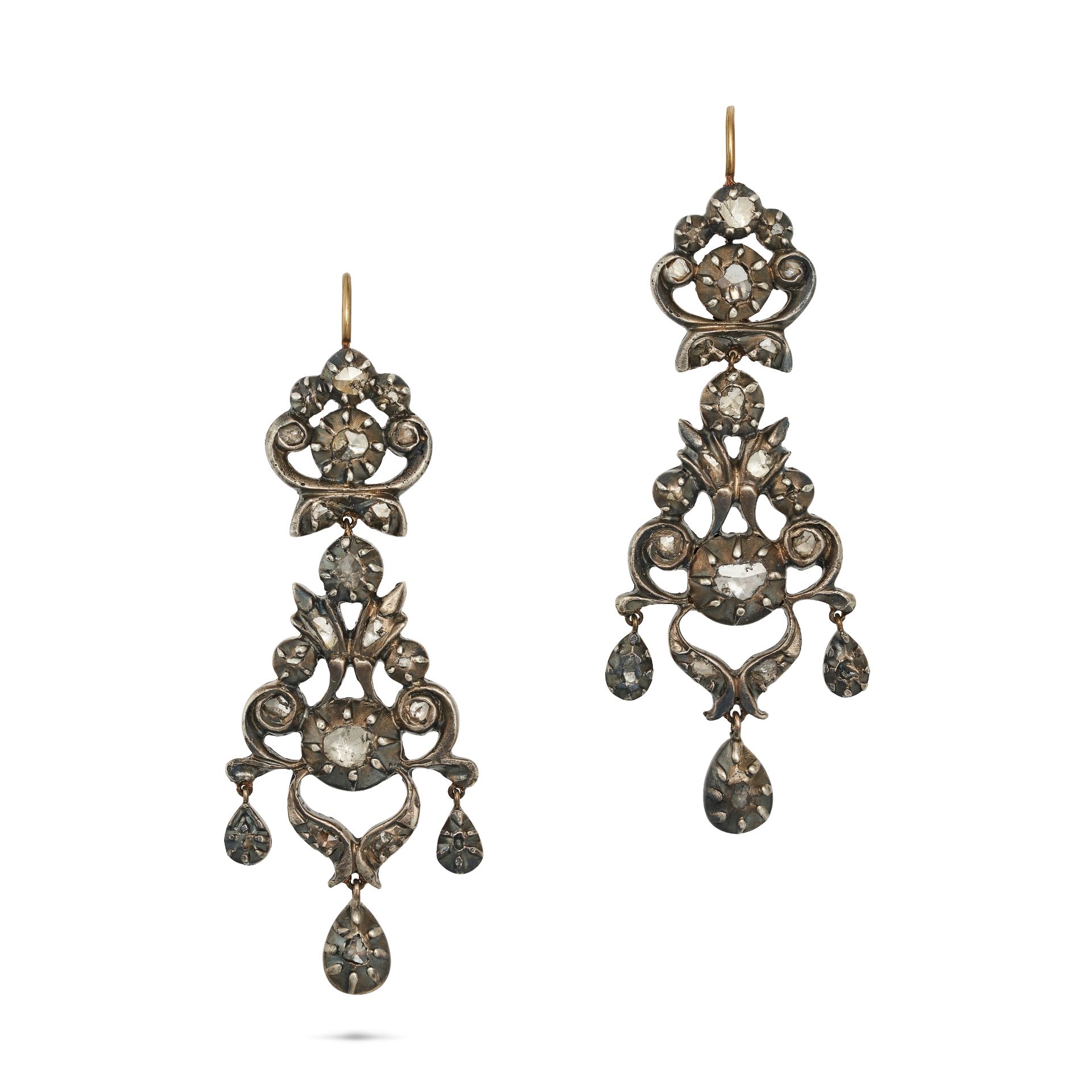 A PAIR OF ANTIQUE DIAMOND DROP EARRINGS in yellow gold and silver, each in an openwork foliate de...