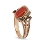 AN ANTIQUE CARNELIAN SWIVEL MOURNING RING in yellow gold, the central panel with the words 'ANN C...
