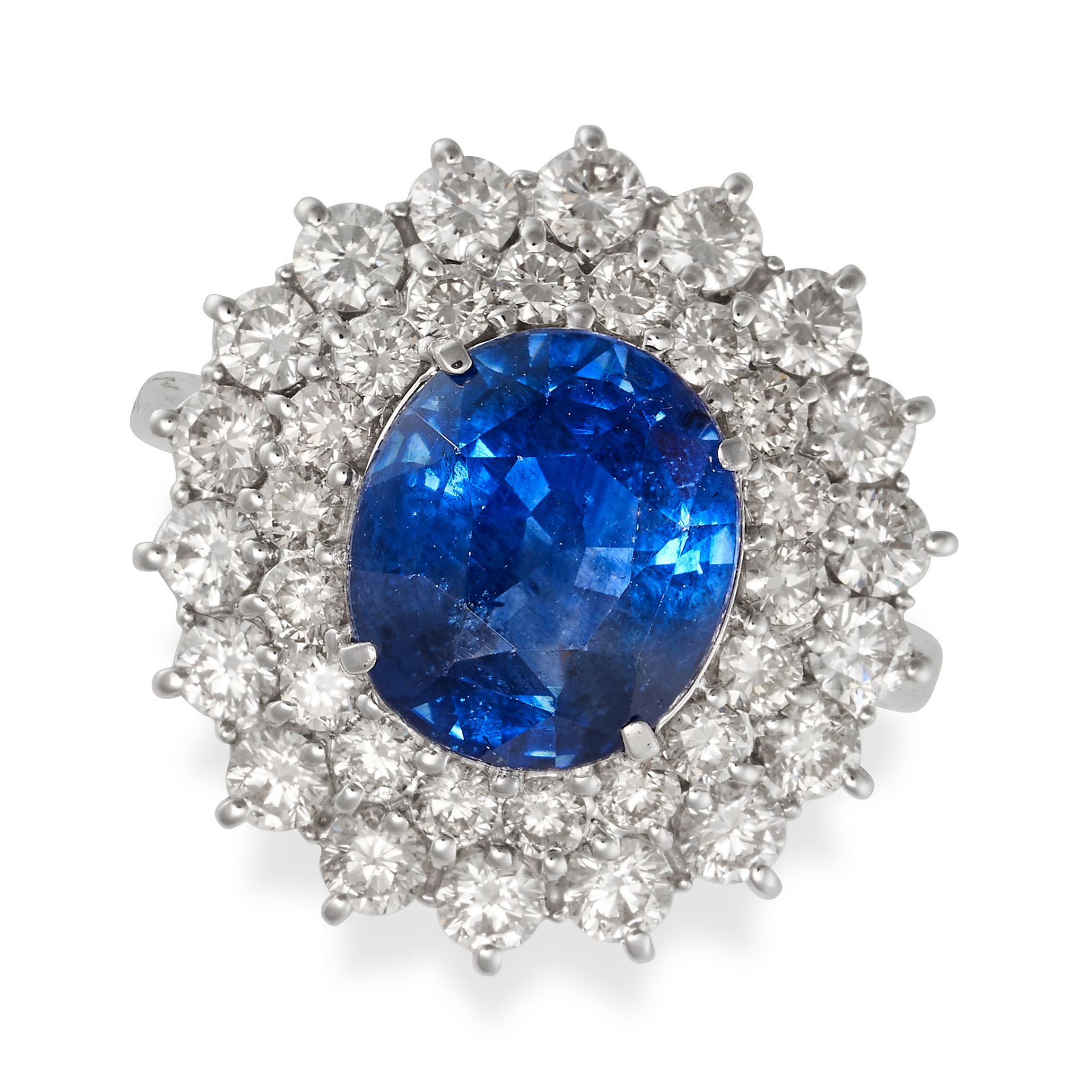 A SAPPHIRE AND DIAMOND CLUSTER RING in 18ct white gold, set with an oval cut sapphire of 3.74 car...