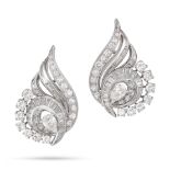 A PAIR OF DIAMOND CLIP EARRINGS in platinum and white gold, in scrolling design set throughout wi...