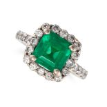 AN EMERALD AND DIAMOND CLUSTER RING in 18ct white gold, set with an octagonal step cut emerald of...