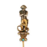 NO RESERVE - AN ANTIQUE TURQUOISE NAPOLEON STICK PIN designed as Napoleon stood on a plinth set w...