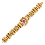 AN ANTIQUE RUSSIAN RUBY AND DIAMOND BRACELET in high carat yellow gold, set with a cabochon ruby ...