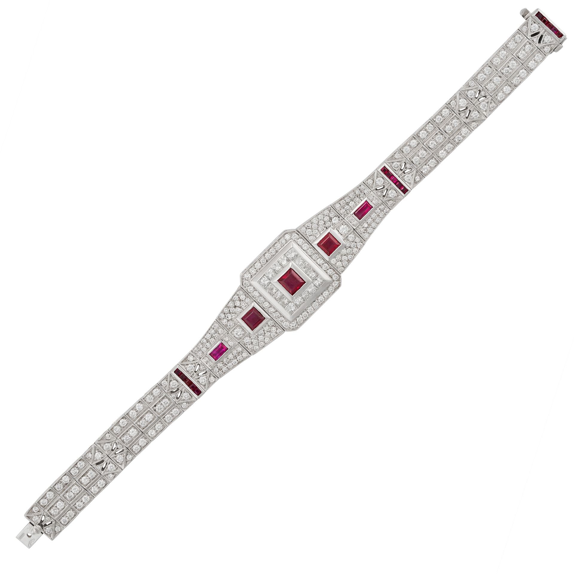 A RUBY AND DIAMOND BRACELET in 18ct white gold, set to the centre with a square step cut ruby in ...